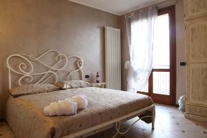 A bed or beds in a room at Portola la vecchia dimora
