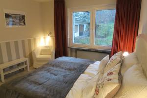 Postel nebo postele na pokoji v ubytování Harzgenuß