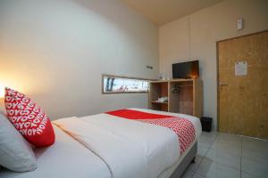 Tempat tidur dalam kamar di Cityzen Renon Hotel