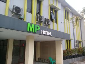 a hotel with a mapp hotel sign in front of it at MP Hotel Purwakarta in Purwakarta