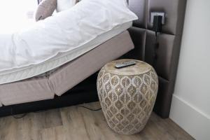 Postel nebo postele na pokoji v ubytování Fruitpark Hotel & Spa