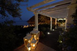 a group of lights on a porch at night at Grand Hotel Il Ninfeo in Gaeta