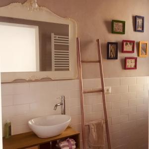 a bathroom with a sink and a mirror at A casa di Nat in Modena +22 photos