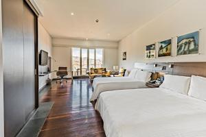 Ένα ή περισσότερα κρεβάτια σε δωμάτιο στο Hotel Spiwak Chipichape Cali