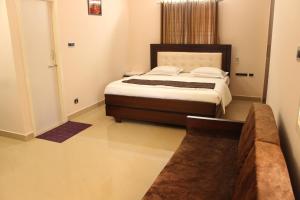 Postel nebo postele na pokoji v ubytování Phoenix Serviced Apartment - Sri Illam