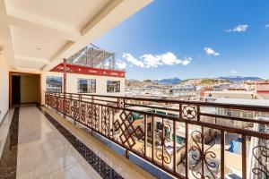 a balcony with a view of a city at Floral Hotel · Shangri-la Blue Sky in Shangri-La