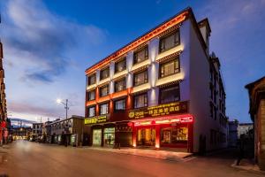a building on the side of a street at Floral Hotel · Shangri-la Blue Sky in Shangri-La