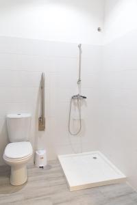 
a bathroom with a toilet and a sink at Aguçadoura Guest House in Póvoa de Varzim
