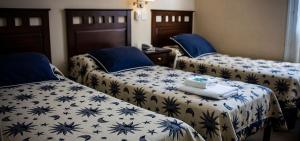 En eller flere senge i et værelse på Hotel Federico I