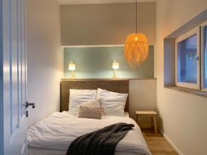 Postel nebo postele na pokoji v ubytování COAST HOUSE Sky Suite