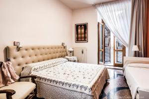 Postel nebo postele na pokoji v ubytování Casa in Centro Foggia