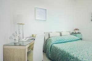 Postel nebo postele na pokoji v ubytování Casa in Centro Foggia