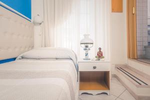 Postel nebo postele na pokoji v ubytování Casa in Centro Foggia