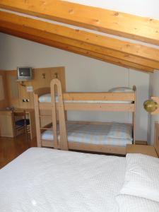 Postel nebo postele na pokoji v ubytování Hotel Al Caminetto