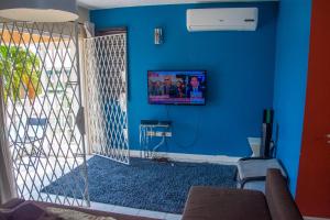 
A television and/or entertainment centre at Finest Accommodation Apt # 421 Bloc # 4 Marley Manor 6 Marley Rd Kgn 6
