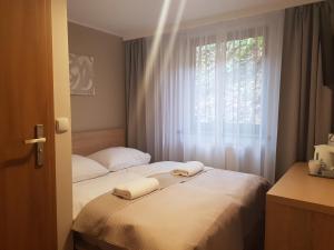 Posteľ alebo postele v izbe v ubytovaní Willa Beskid