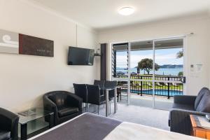 a hotel room with a view of the ocean at Anchorage Motel in Paihia
