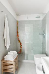 a bathroom with a shower and a toilet and a sink at MyNavona in Rome +54 photos