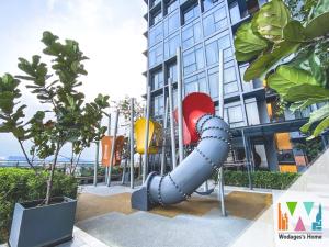 a blue slide in front of a building at Expressionz KLCC by Wodages, 300mbps Wifi in Kuala Lumpur +153 photos