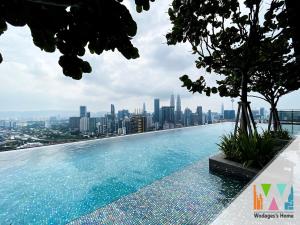 a swimming pool on top of a city skyline at Expressionz KLCC by Wodages, 300mbps Wifi in Kuala Lumpur