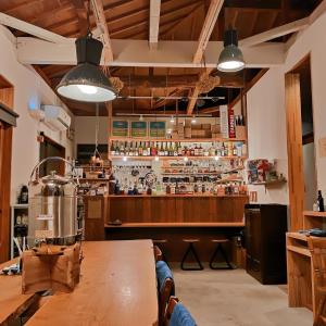 a bar at a restaurant with a wooden table at Brücke Arima KOBE in Kobe