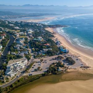 an aerial view of a beach and the ocean at Plett Beachfront Guest House in Plettenberg Bay