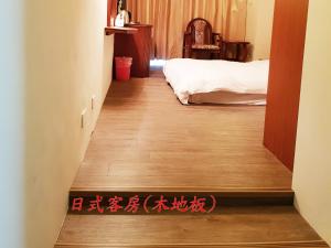 Una cama o camas en una habitación de Hsinchu Shih business hall