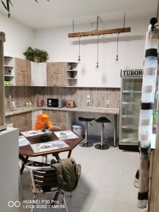 a kitchen with a table and chairs and a counter at Hotel Belisimo in Ruse