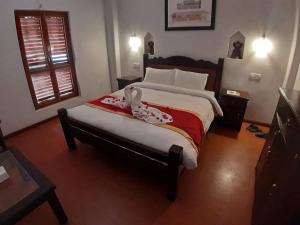 A bed or beds in a room at The Hotel