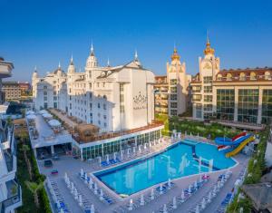 an aerial view of a resort with a swimming pool at Side Royal Palace in Side
