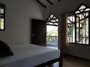 A bed or beds in a room at Villa Goodwill Paradise