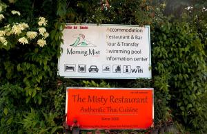 a sign for the music museum and a sign for the music museum restart and bar at Khao Sok Morning Mist Resort in Khao Sok