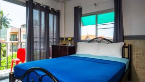 Postel nebo postele na pokoji v ubytování Sabina Guesthouse Kamala