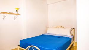 Postel nebo postele na pokoji v ubytování Sabina Guesthouse Kamala