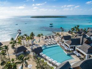 an aerial view of a resort with a swimming pool and the ocean at Preskil Island Resort in Mahébourg