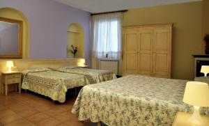 Postel nebo postele na pokoji v ubytování Hotel Regina