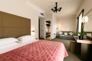 Кровать или кровати в номере Hotel Continental Wellness & Spa