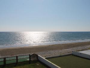 a view of the beach from the balcony of a house at Panorama Beach House, 5 meters to the sea in Perivolia