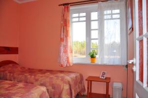 Postel nebo postele na pokoji v ubytování Guesthouse Leiputrija