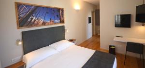 TV a/nebo společenská místnost v ubytování Albergo Centrale