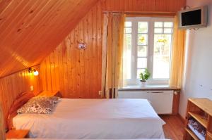 Postel nebo postele na pokoji v ubytování Guesthouse Leiputrija