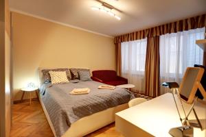Posteľ alebo postele v izbe v ubytovaní Old Town Apartment