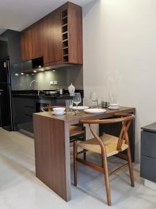 Kuchyň nebo kuchyňský kout v ubytování Mae Pim Dream Condo