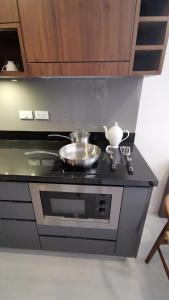 Kuchyň nebo kuchyňský kout v ubytování Mae Pim Dream Condo