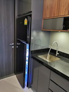 Kuchyň nebo kuchyňský kout v ubytování Mae Pim Dream Condo