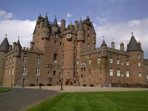 a castle with a clock on the front of it at Hazeldene Guest House in Perth