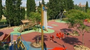 a park with a playground with a slide at GoOutside Toscana in Sarteano