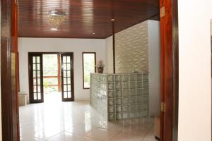 a hallway of a home with a glass wall at Casa Pedra Bonita in Rio de Janeiro
