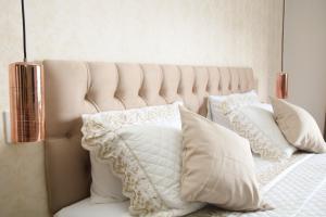 a bedroom with a bed with white pillows on it at Casa Pedra Bonita in Rio de Janeiro