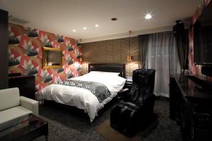 Postel nebo postele na pokoji v ubytování HOTEL Birthday 楠店